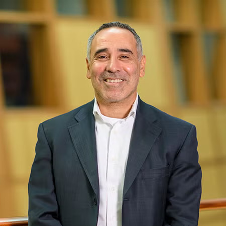 Elie Farhat from Georgetown headshot smiling in the Hariri business school building