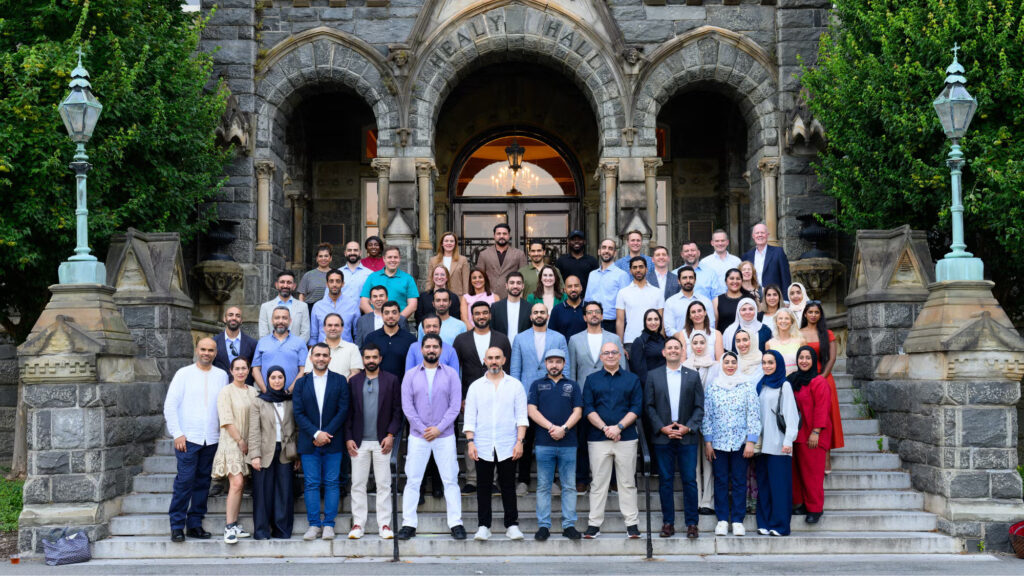 EMBA class visit to Georgetown campus, the students gather in front of the historic Healy Hall.