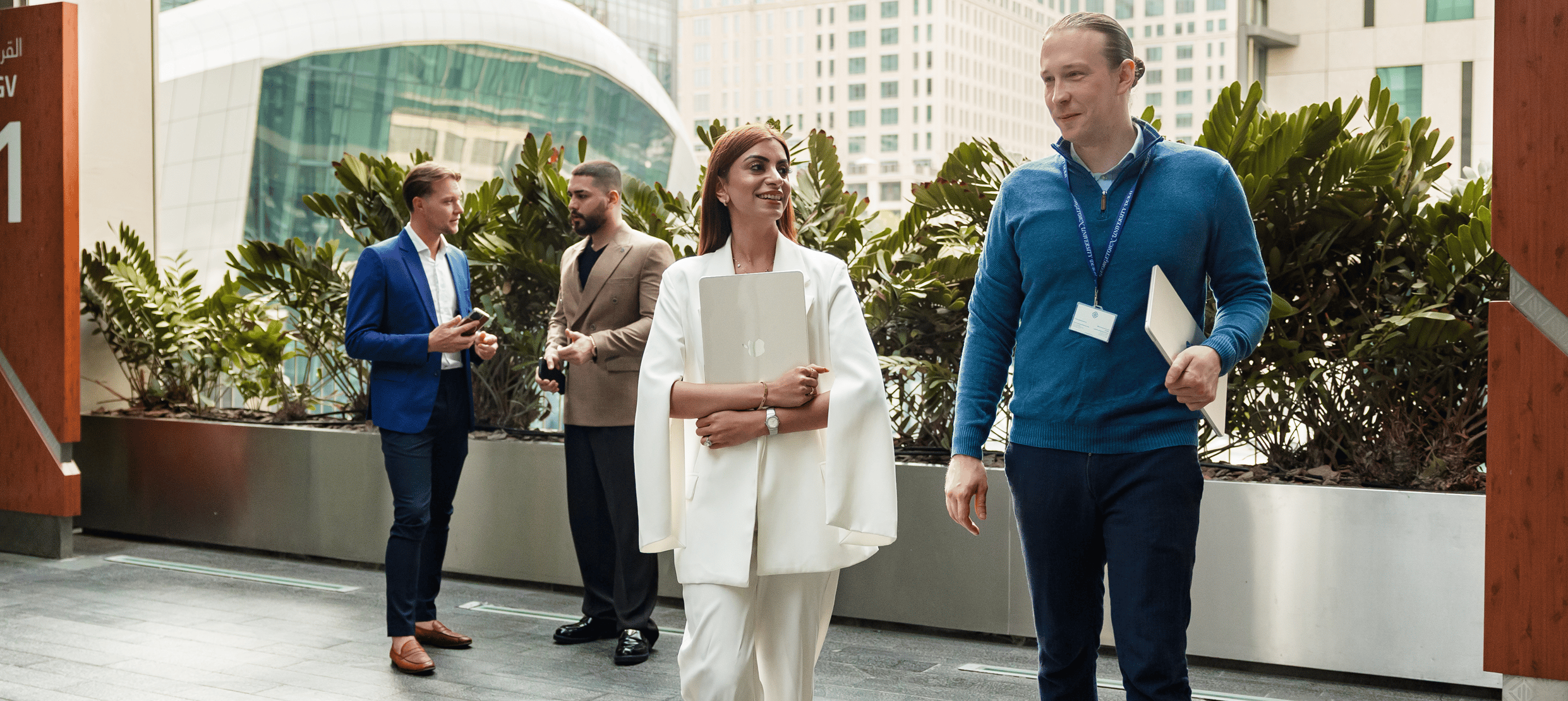 Georgetown Dubai Custom Executive students conversing with each other.